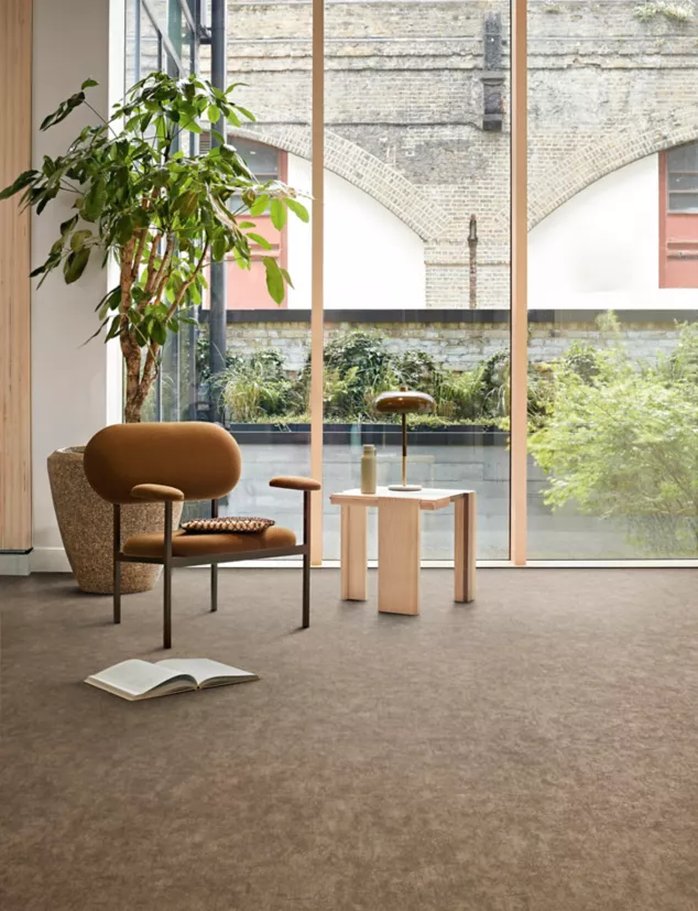 Interface plank LVT in lobby area with glass walls and multiple plants
